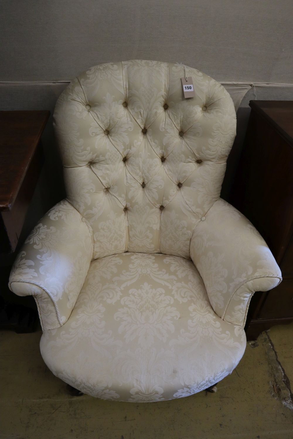 A Victorian walnut buttoned-back armchair, width 81cm